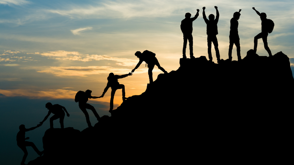 People climbing a mountain to represent cdo data leadership in 2023